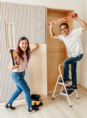 Travis on a stepladder and Anita holding power tools as the two take on an epic DIY!